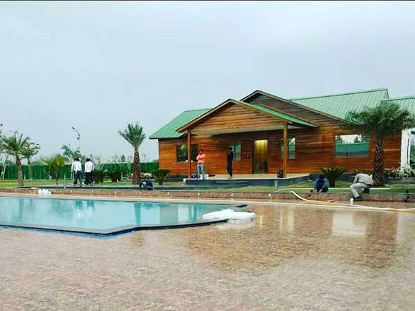 Swimming pool and clubhouse at Green Beauty Farms