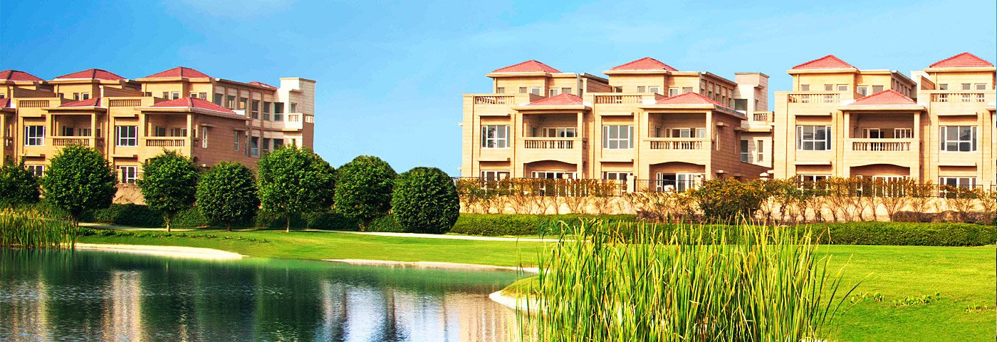 Jaypee Greens golf course panorama with township towers beyond